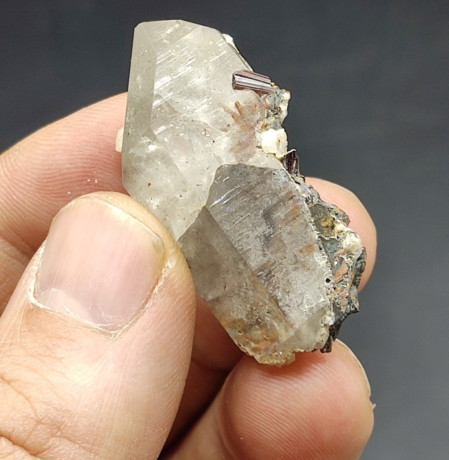 An Aesthetic specimen of quartz crystal with hematite and saginite 16 grams