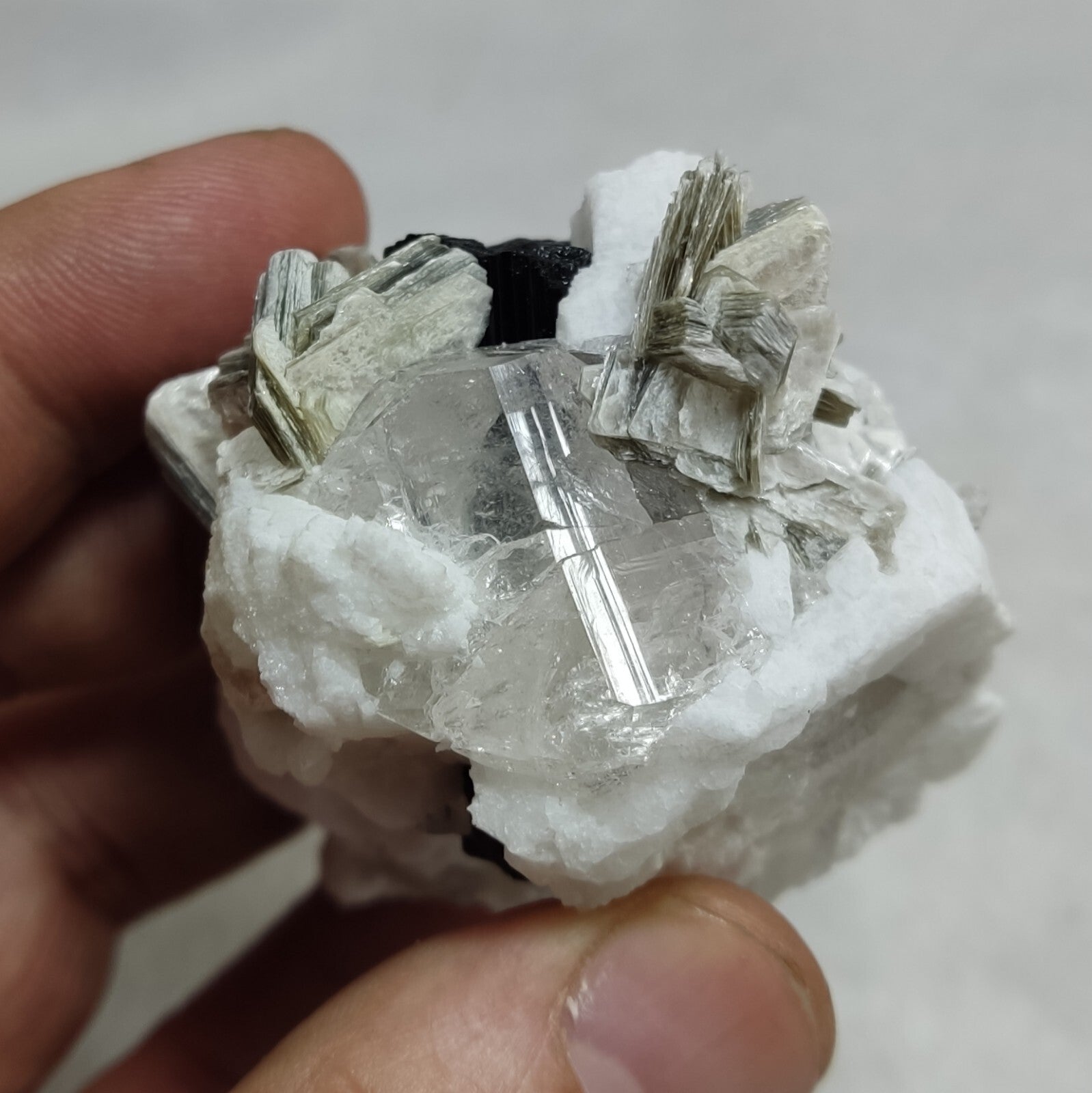 An amazing specimen of quartz with muscovite and albite 134 grams