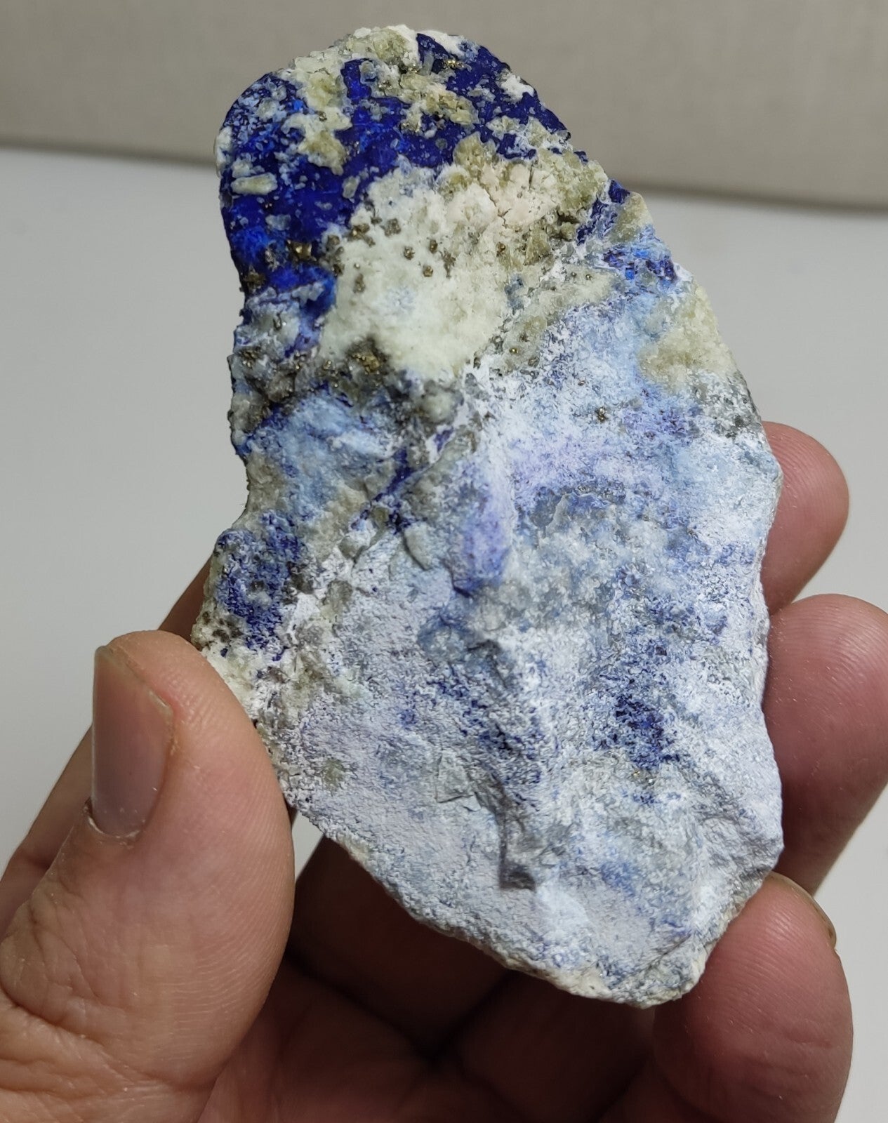 An Aesthetic specimen of fluorescent Lazurite with Pyrite 128 grams