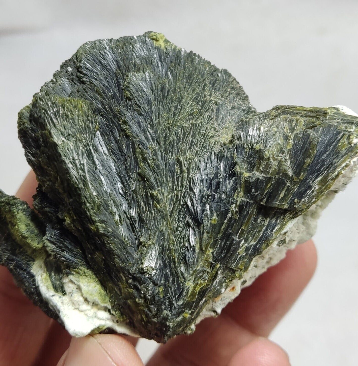 An aesthetic specimen of epidote crystal spray type on matrix 182 grams