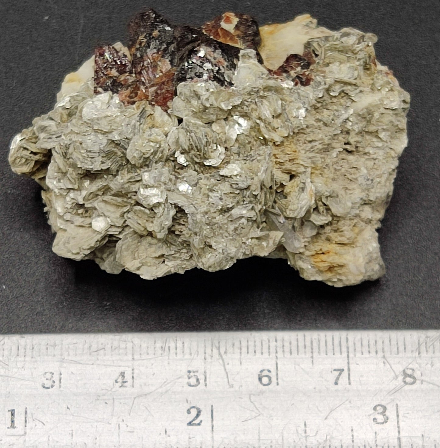 An aesthetic specimen of spessartine garnets on muscovite 58 grams