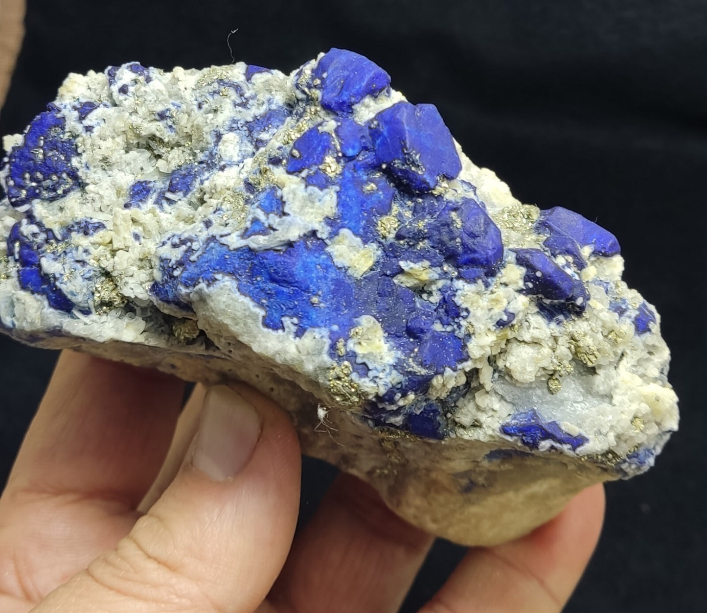 An Aesthetic specimen of fluorescent Lazurite with pyrite 489 grams