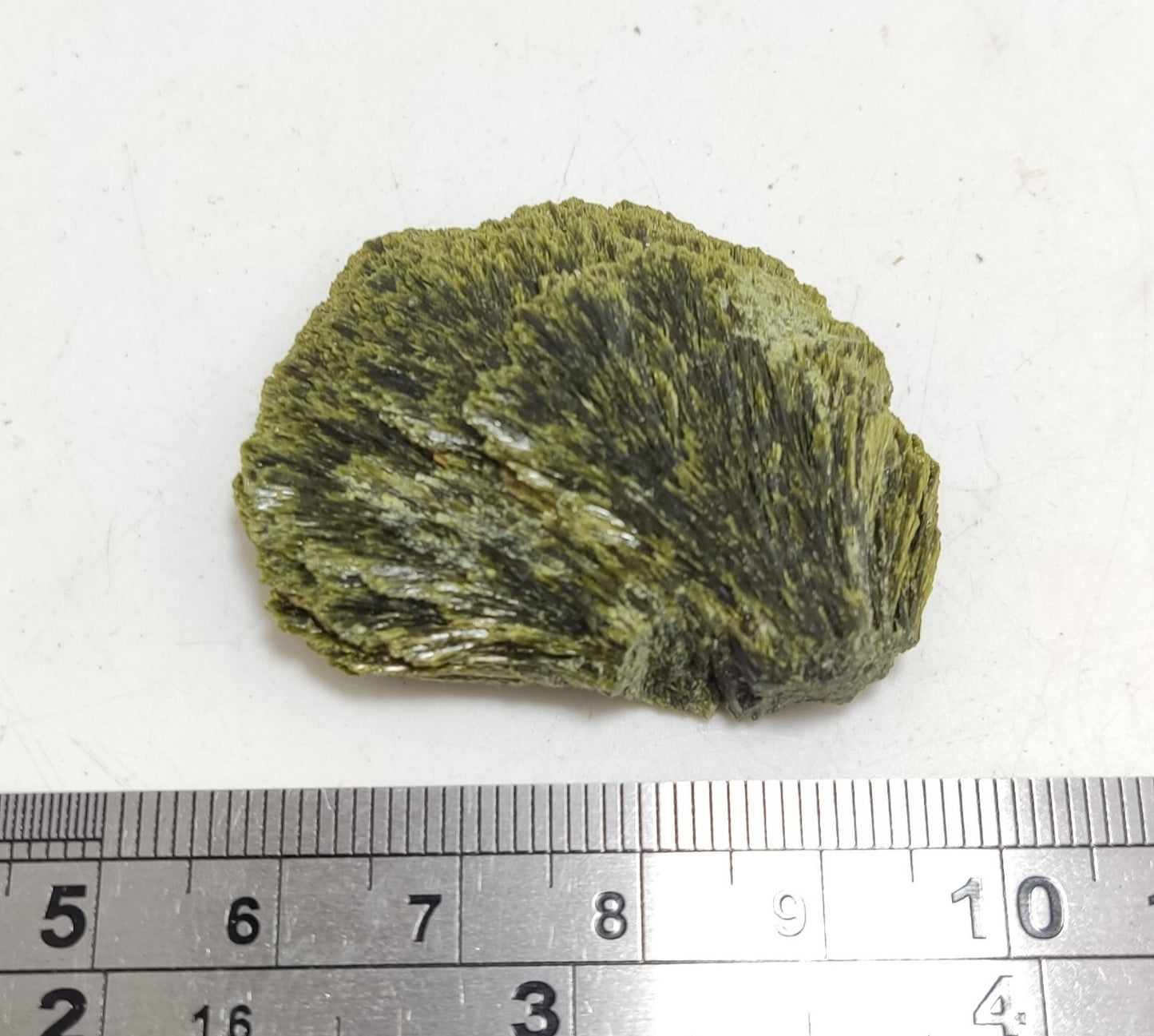 An aesthetic specimen of epidote crystal spray type 22 grams
