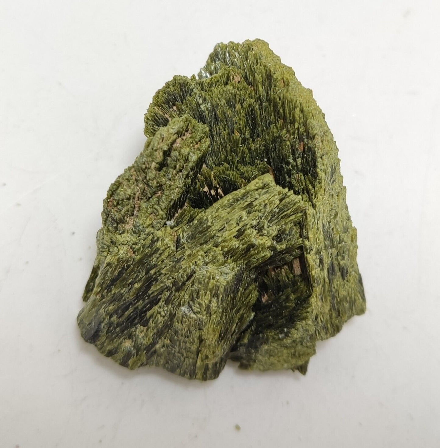 An aesthetic specimen of epidote crystal spray type 35 grams