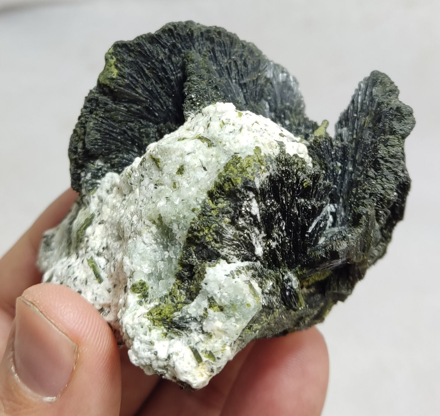 An aesthetic specimen of epidote crystal spray type on matrix 182 grams