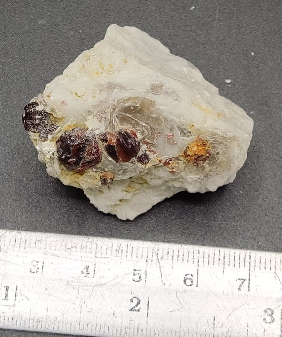 An aesthetic specimen of spessartine garnets on albite/feldspar 45 grams