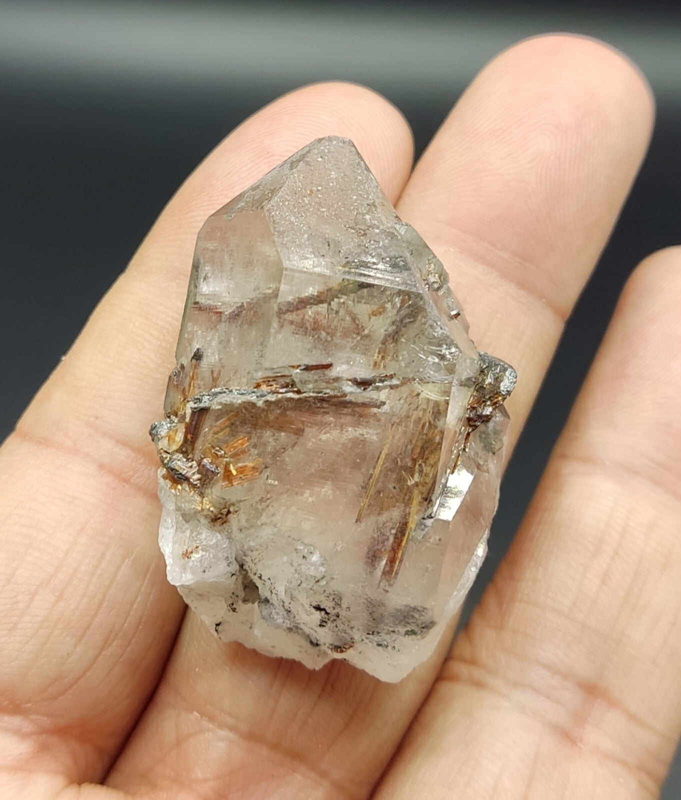 An aesthetic specimen of quartz with hematite and rutile inclusions 28 grams