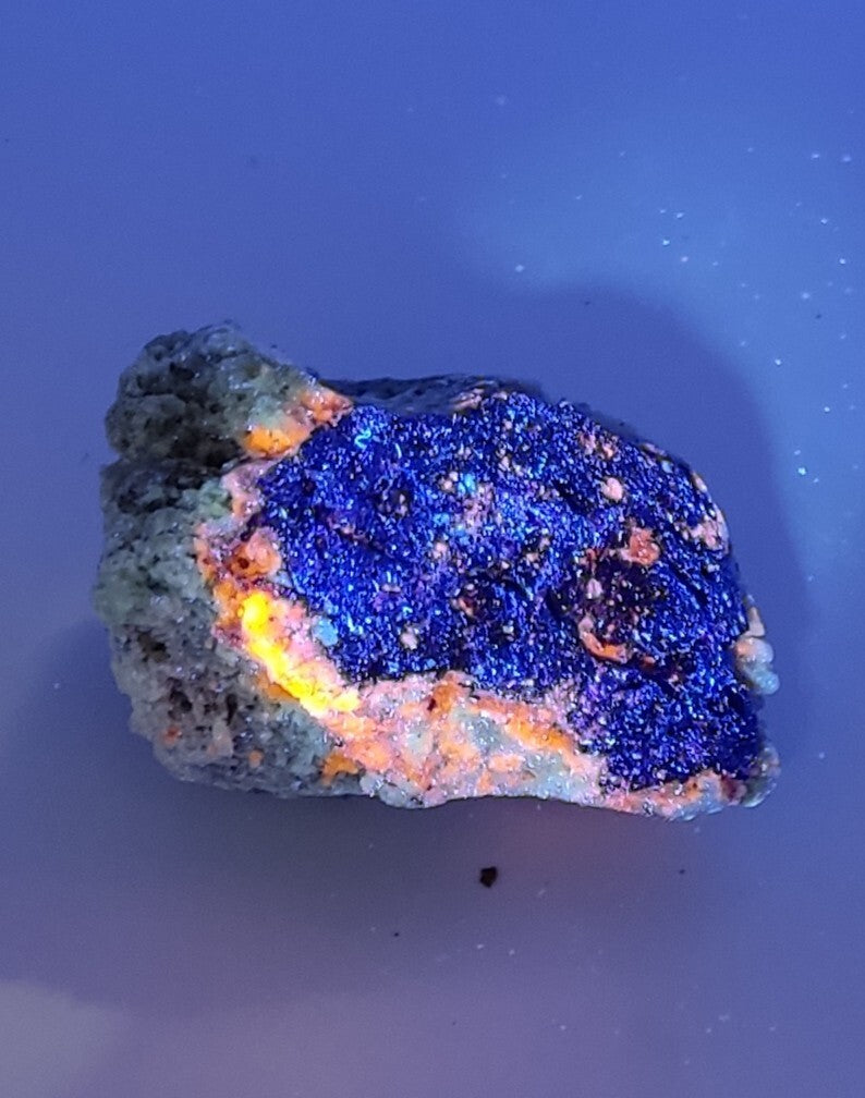 An Aesthetic specimen of fluorescent Lazurite with pyrite 181 grams