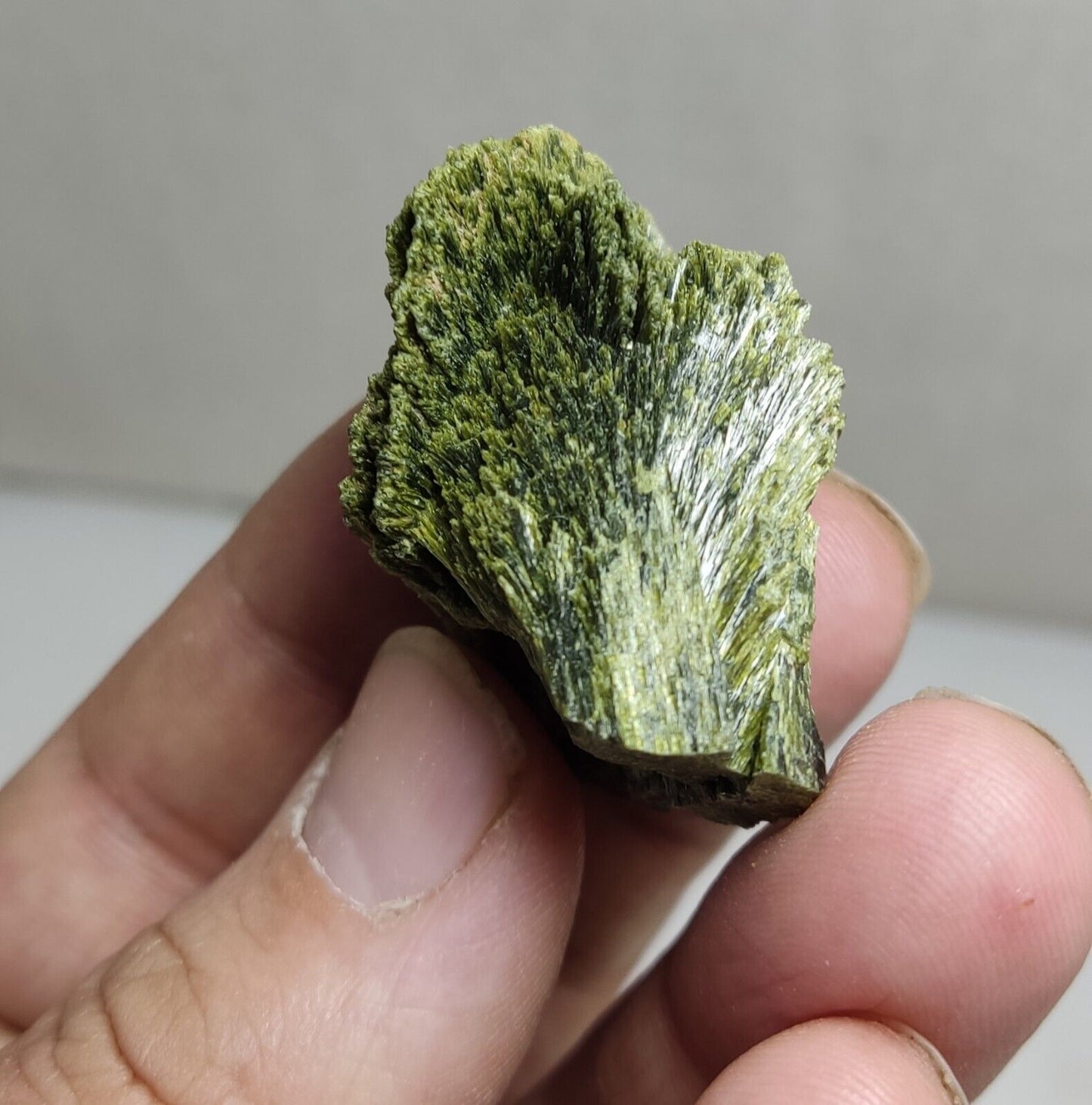 An aesthetic specimen of epidote crystal spray type 35 grams