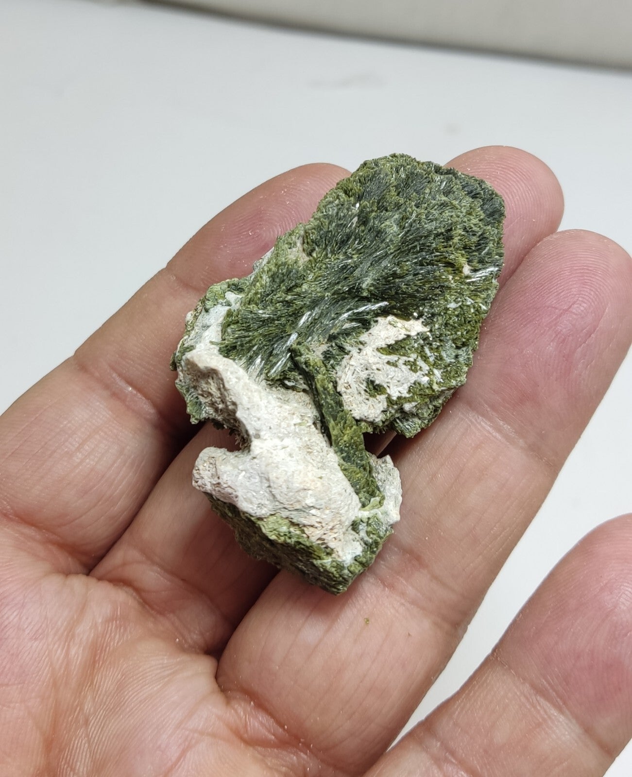 An aesthetic specimen of epidote crystal spray type 34 grams