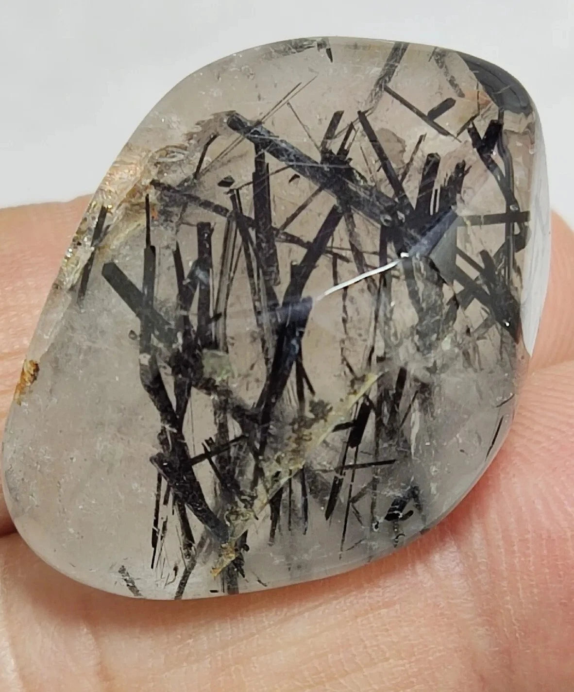 Rutiles/aegirine/ Unconfirmed quartz polished tumble 75 carats