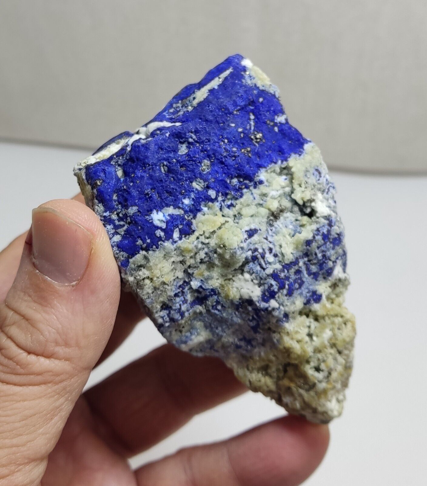 An Aesthetic specimen of fluorescent Lazurite with Pyrite 296 grams