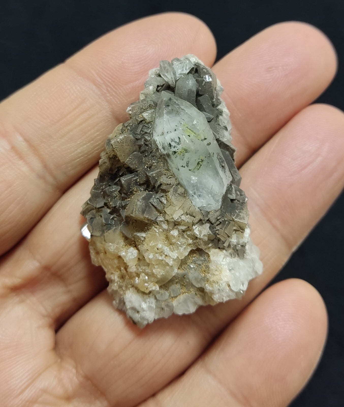 An Aesthetic quartz/calcite crystal specimen with petroleum inclusions 23 grams