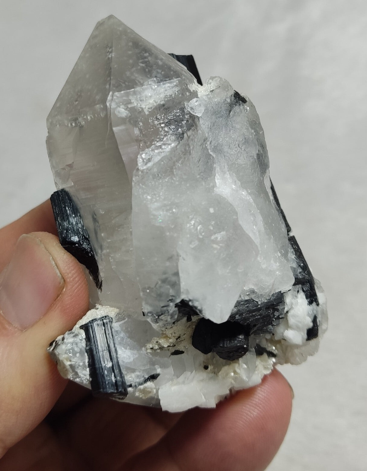 Natural quartz crystal with black tourmaline 145 grams