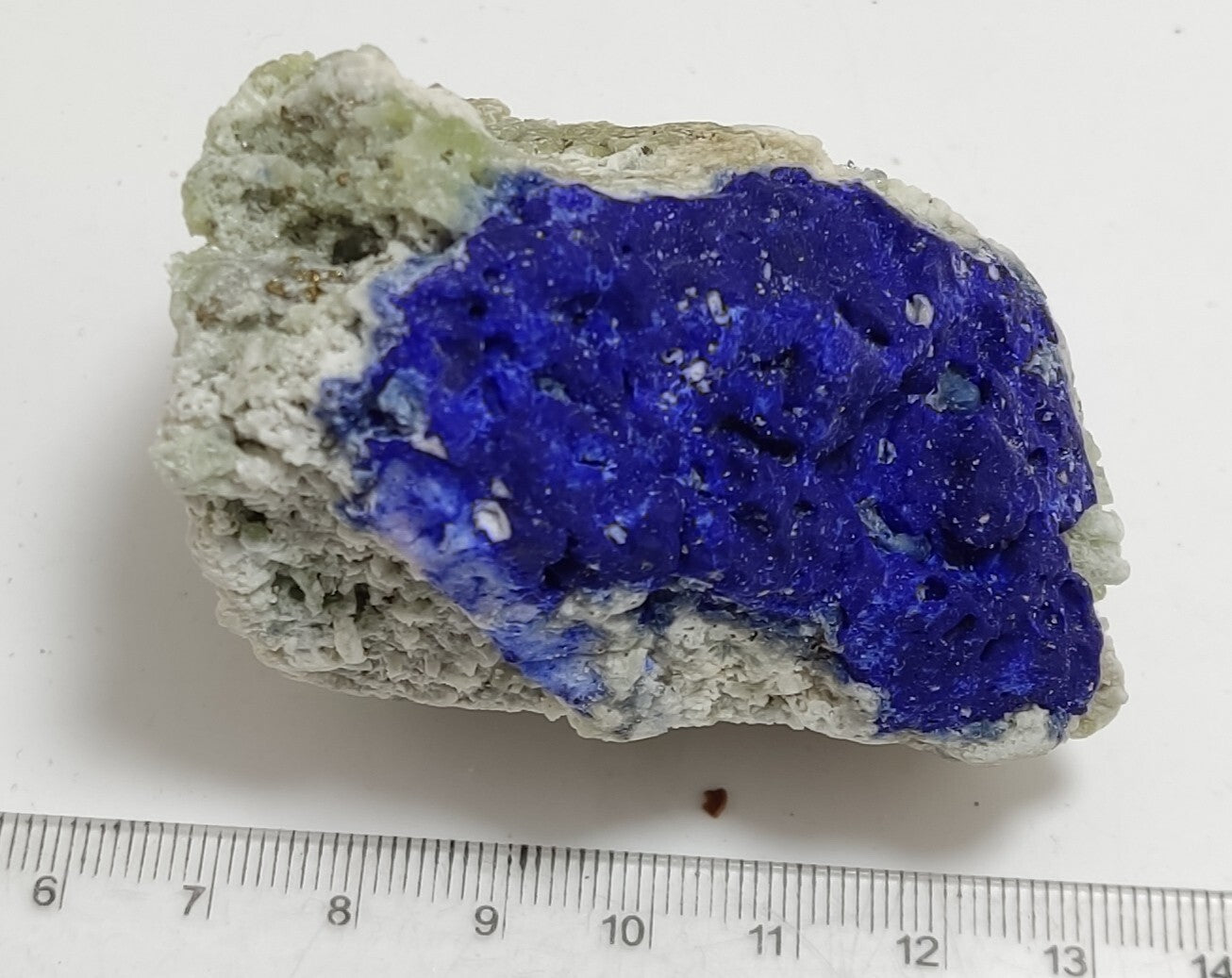 An Aesthetic specimen of fluorescent Lazurite with pyrite 181 grams