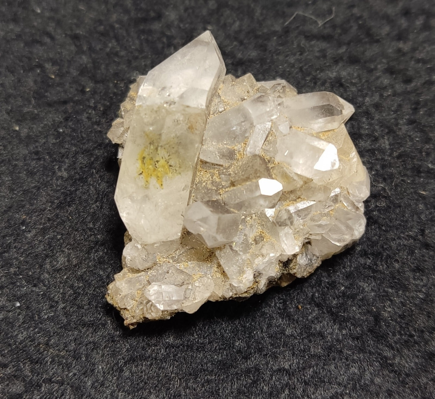 An Aesthetic quartz/calcite crystal specimen with petroleum inclusions 15 grams