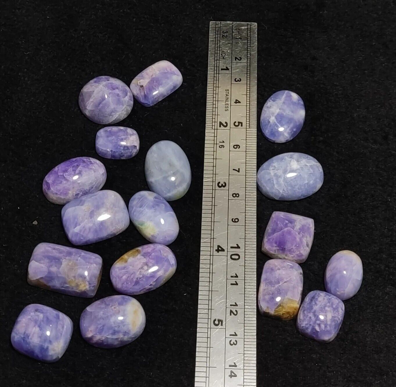 17 pieces Hackmanite cabochons  fluorescent collective weight 350 carats