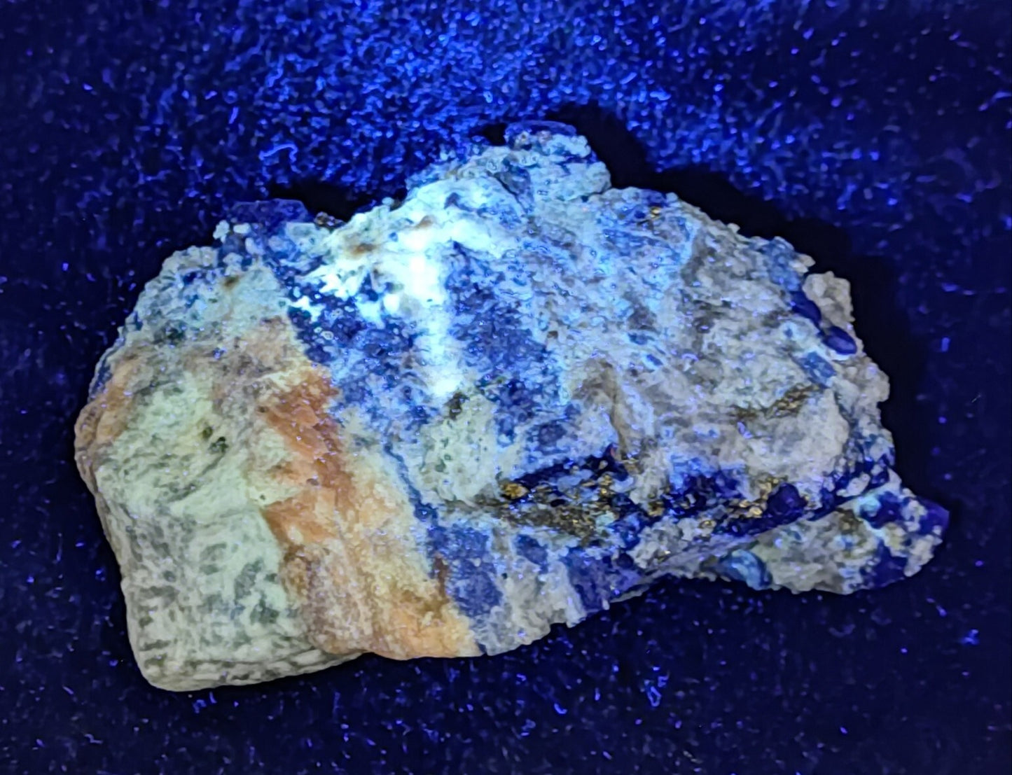 An Aesthetic specimen of fluorescent Lazurite with pyrite 489 grams