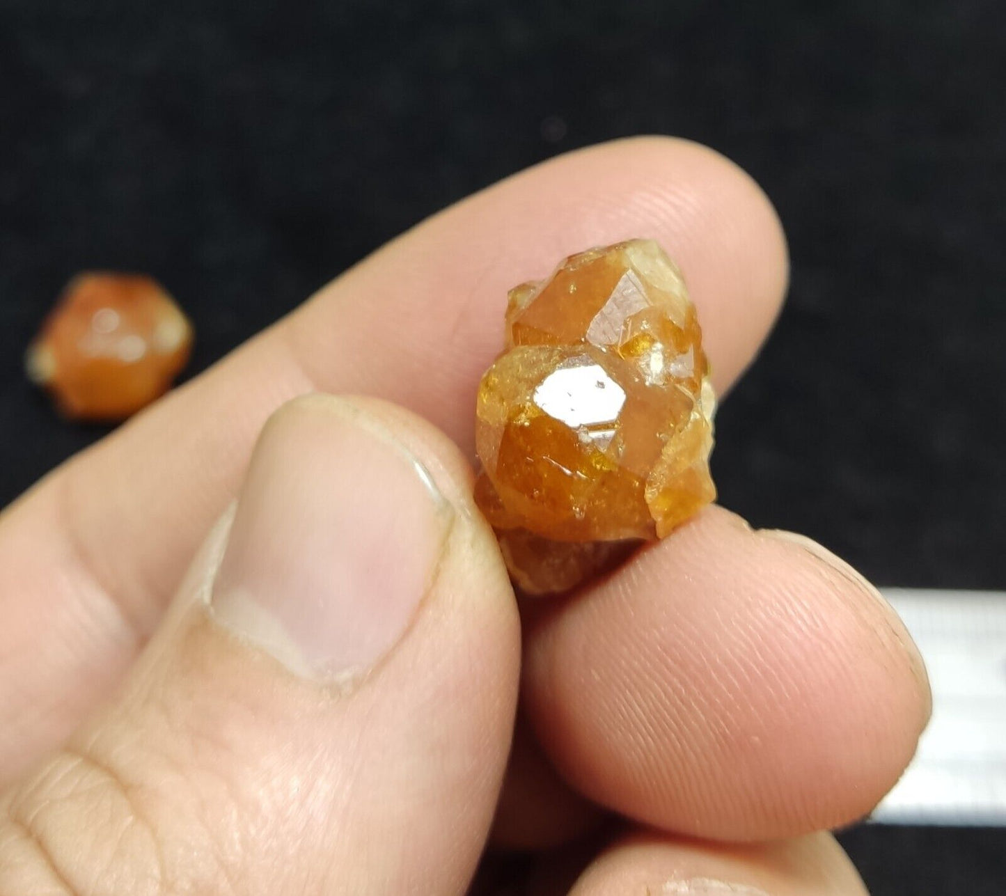 A selection of three garnet variety hessonite crystals 14.8 grams