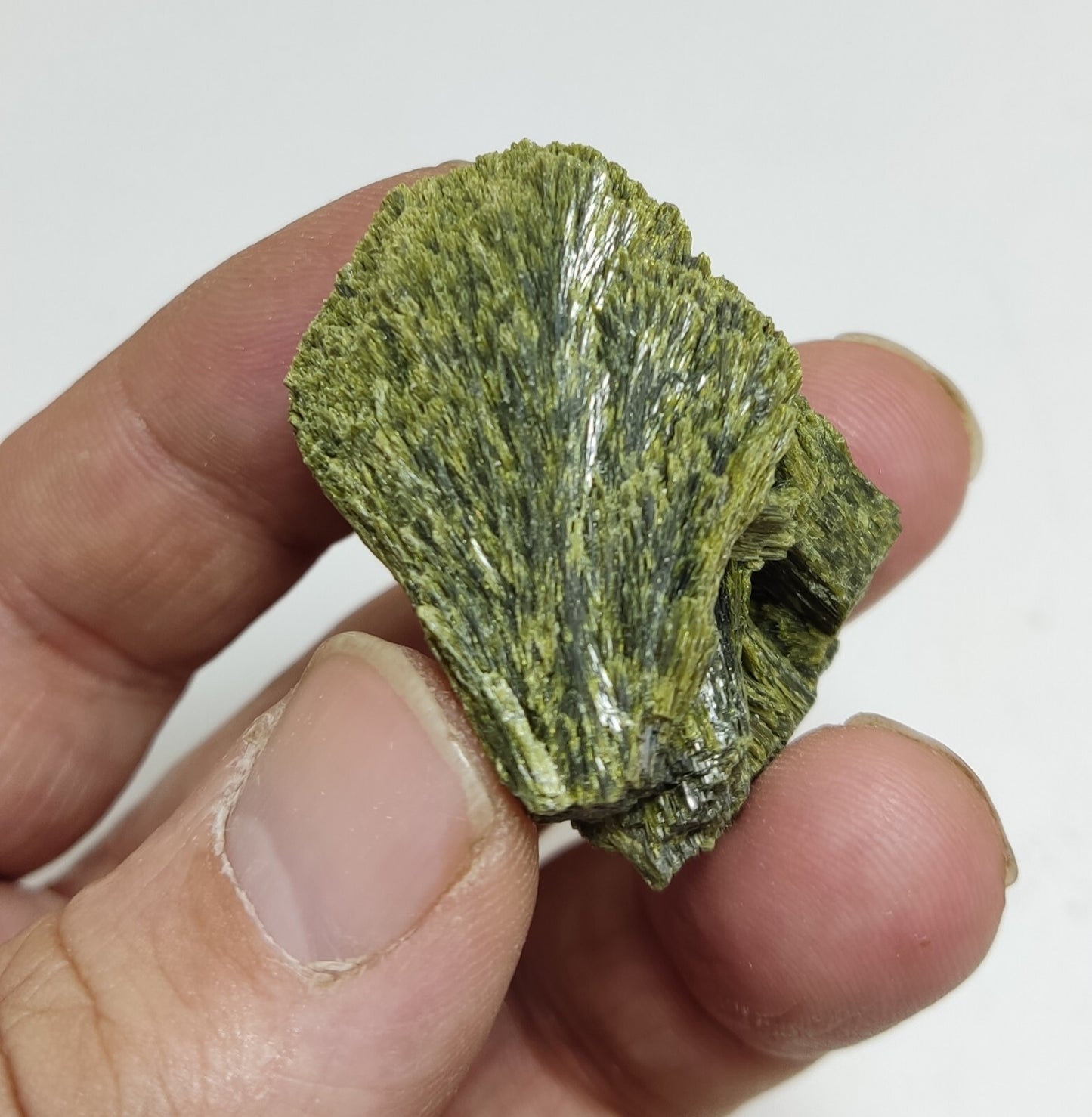 An aesthetic specimen of epidote crystal spray type 35 grams