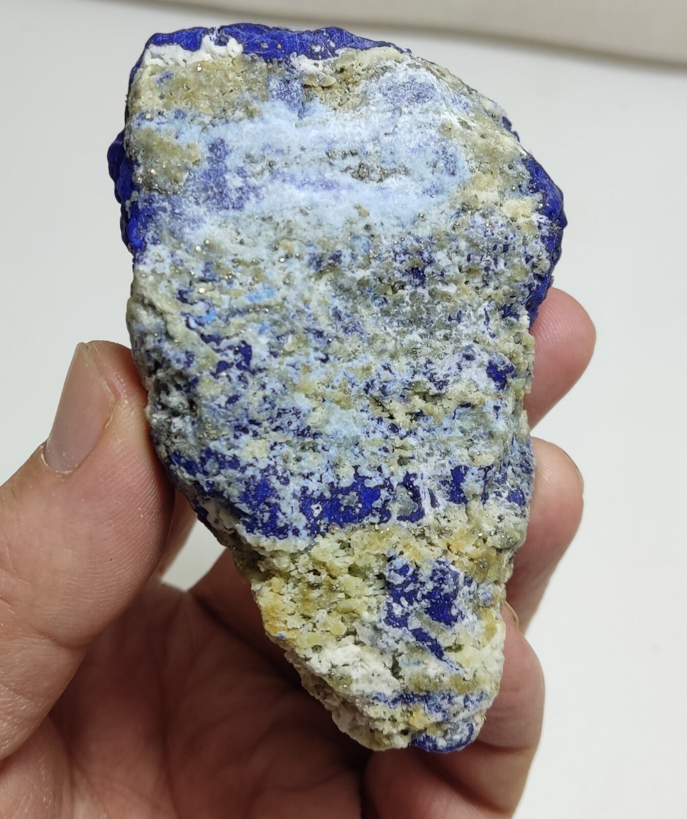 An Aesthetic specimen of fluorescent Lazurite with Pyrite 296 grams