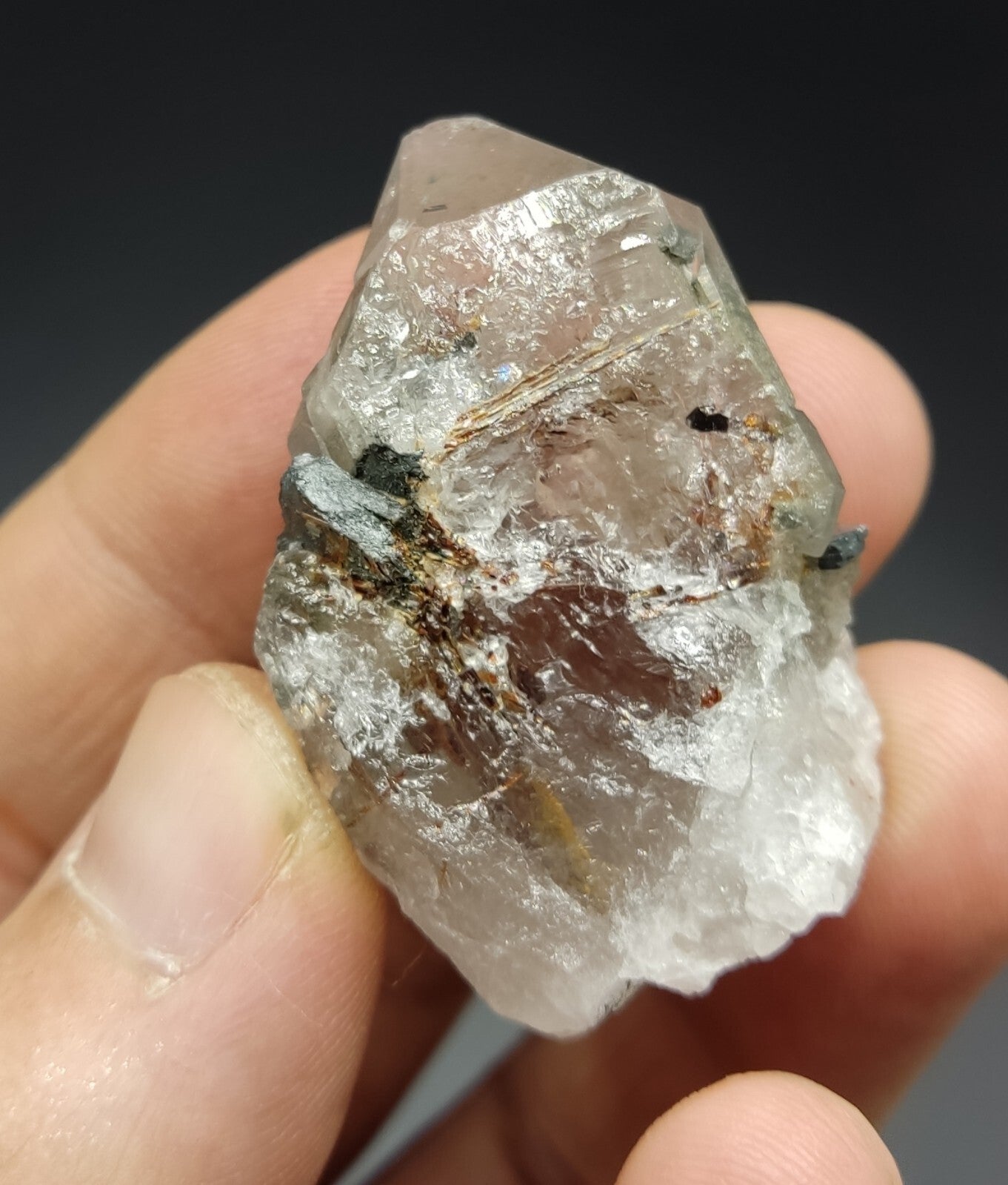 An aesthetic specimen of quartz with hematite and rutile inclusions 28 grams
