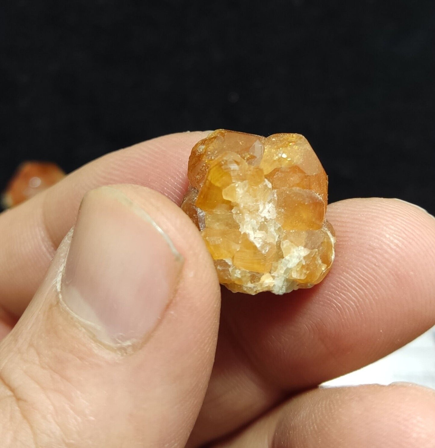 A selection of three garnet variety hessonite crystals 14.8 grams