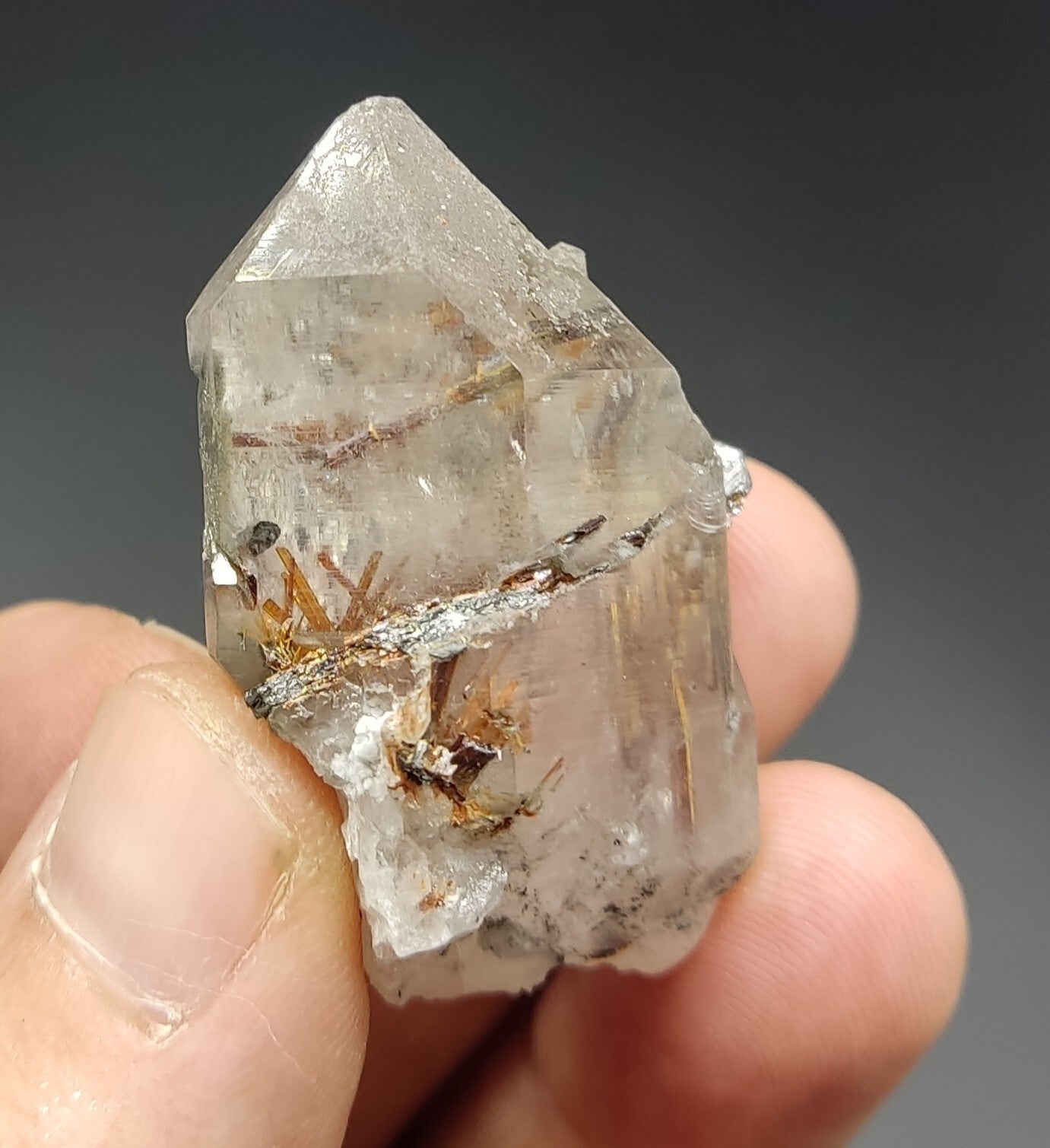 An aesthetic specimen of quartz with hematite and rutile inclusions 28 grams