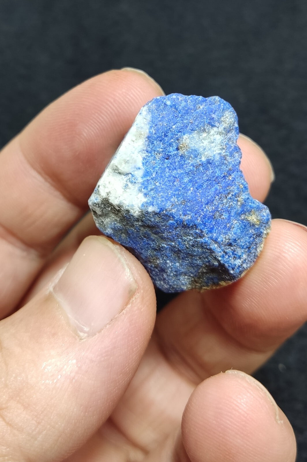 An Aesthetic specimen of fluorescent lapis/lazurite on matrix 23 grams
