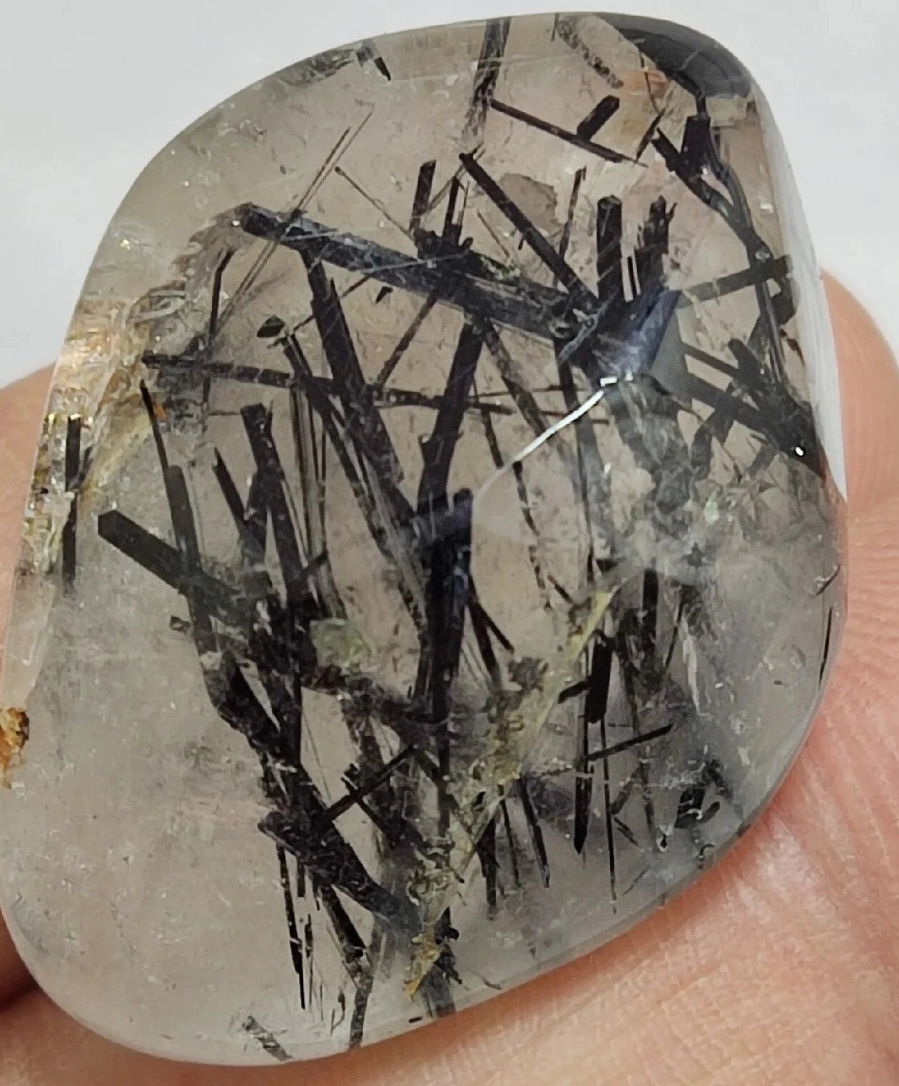 Rutiles/aegirine/ Unconfirmed quartz polished tumble 75 carats
