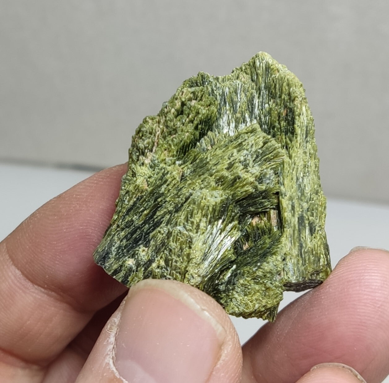 An aesthetic specimen of epidote crystal spray type 35 grams