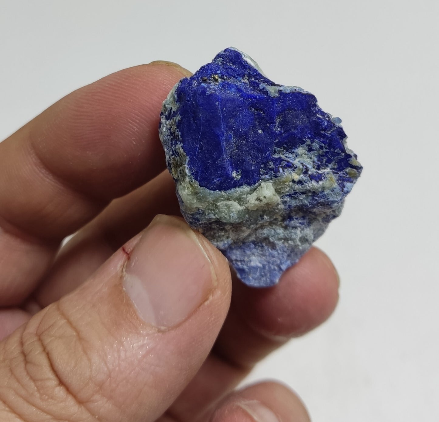 An Aesthetic specimen of fluorescent Lazurite with pyrite 25 grams