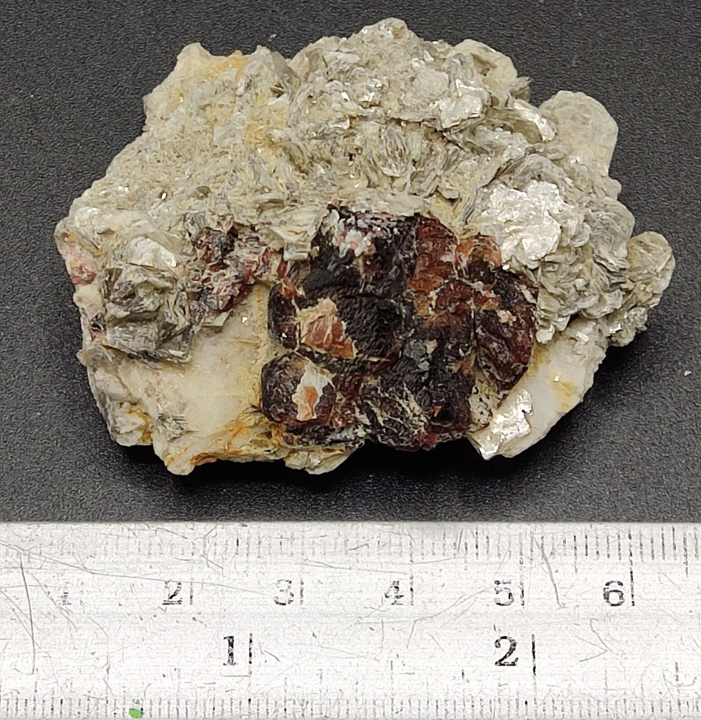 An aesthetic specimen of spessartine garnets on muscovite 58 grams