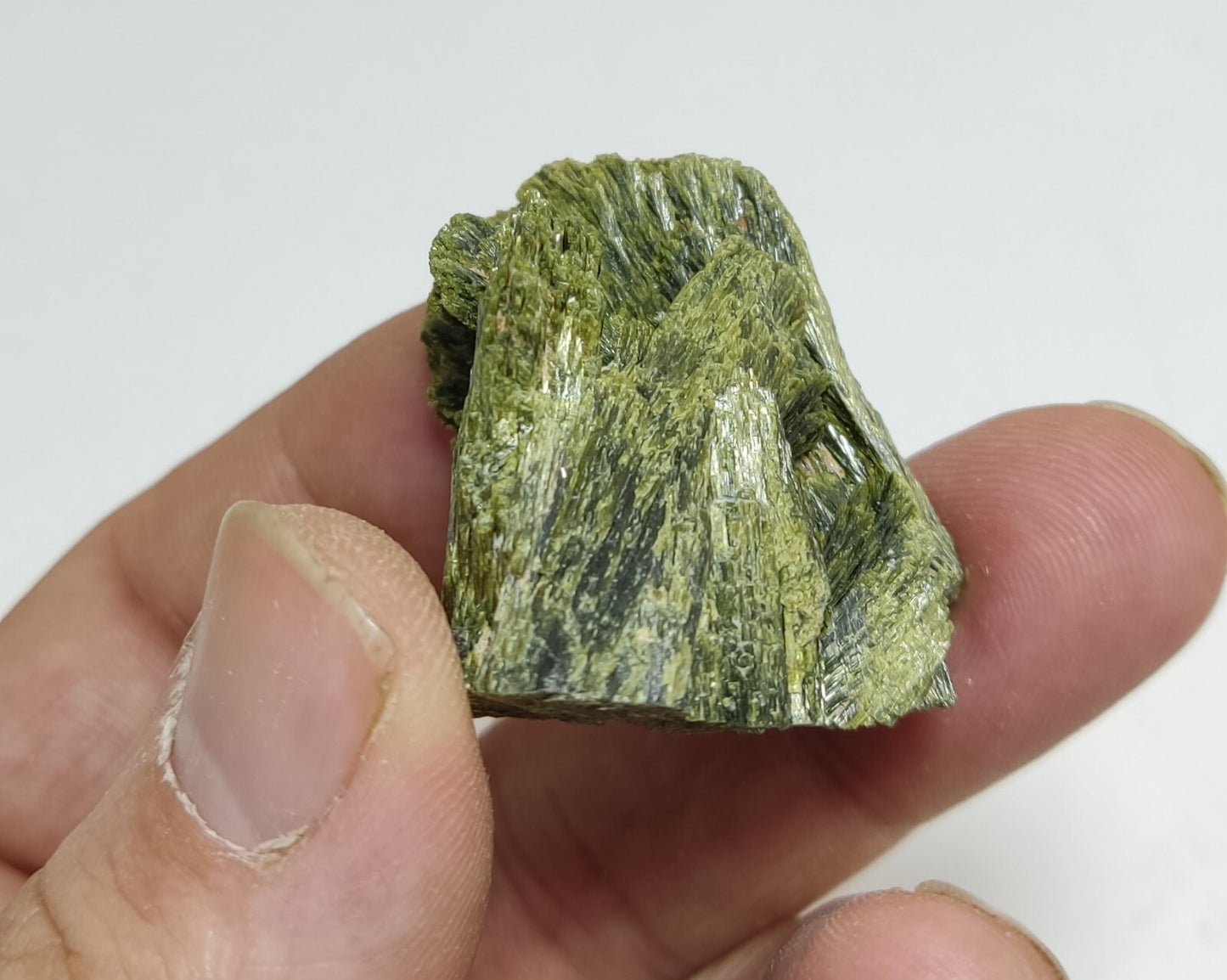 An aesthetic specimen of epidote crystal spray type 35 grams