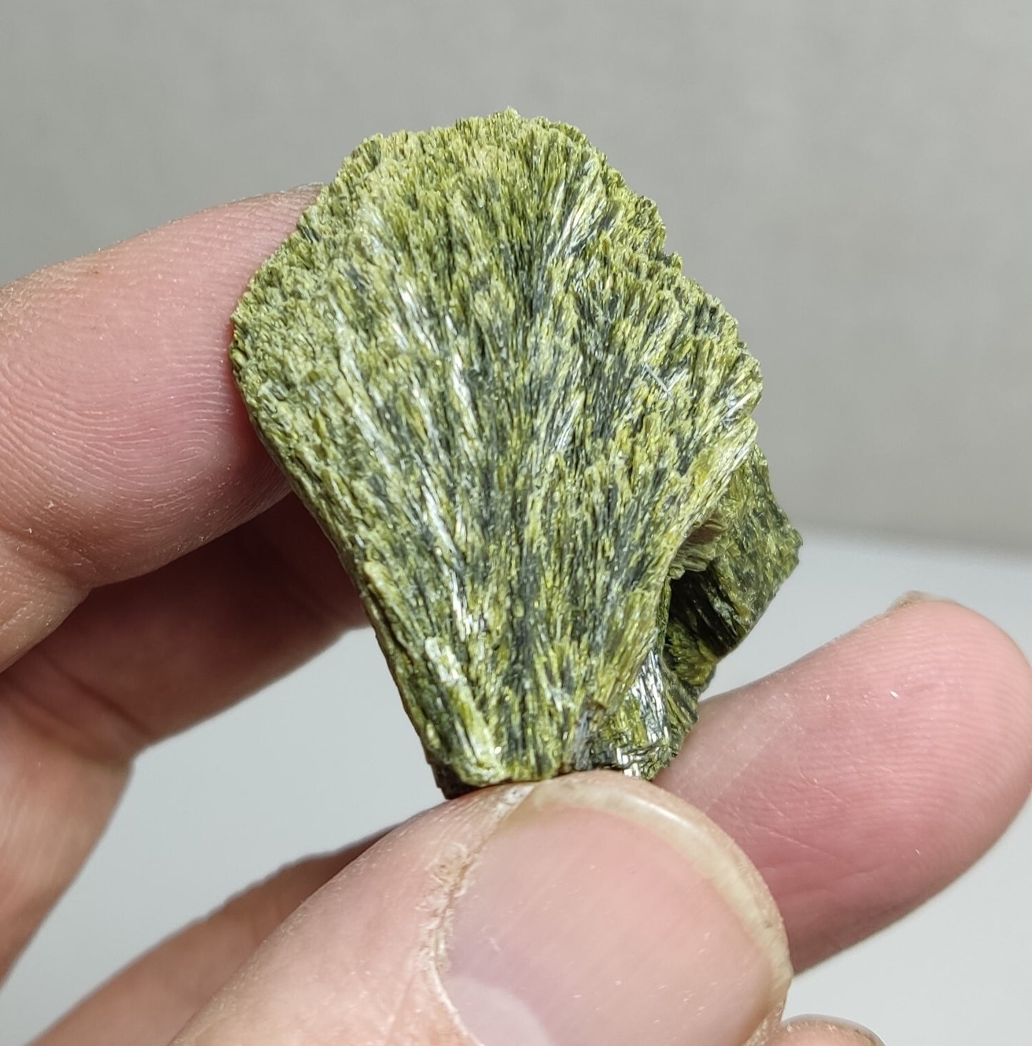 An aesthetic specimen of epidote crystal spray type 35 grams