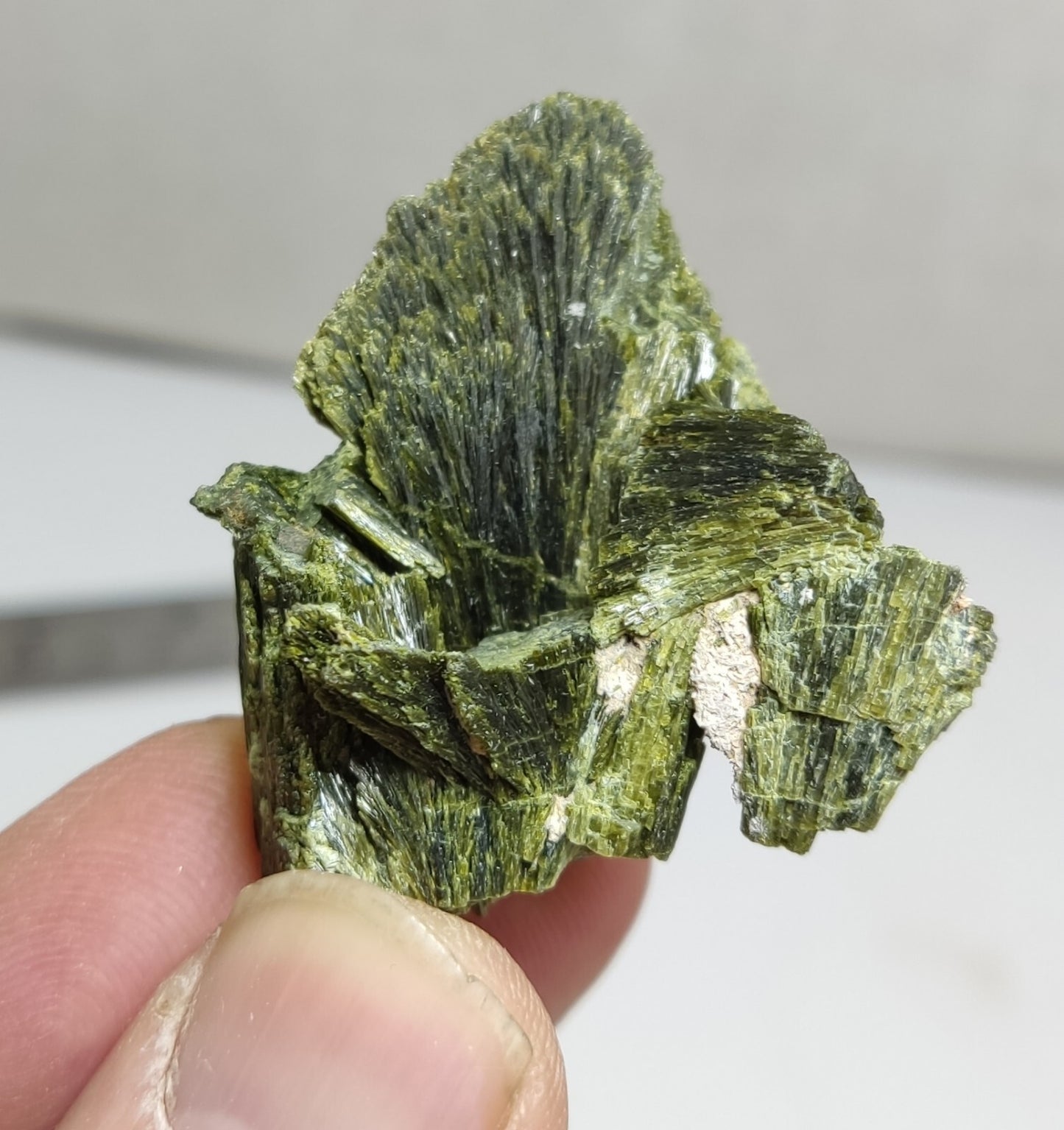 An aesthetic specimen of epidote crystal spray type 27 grams