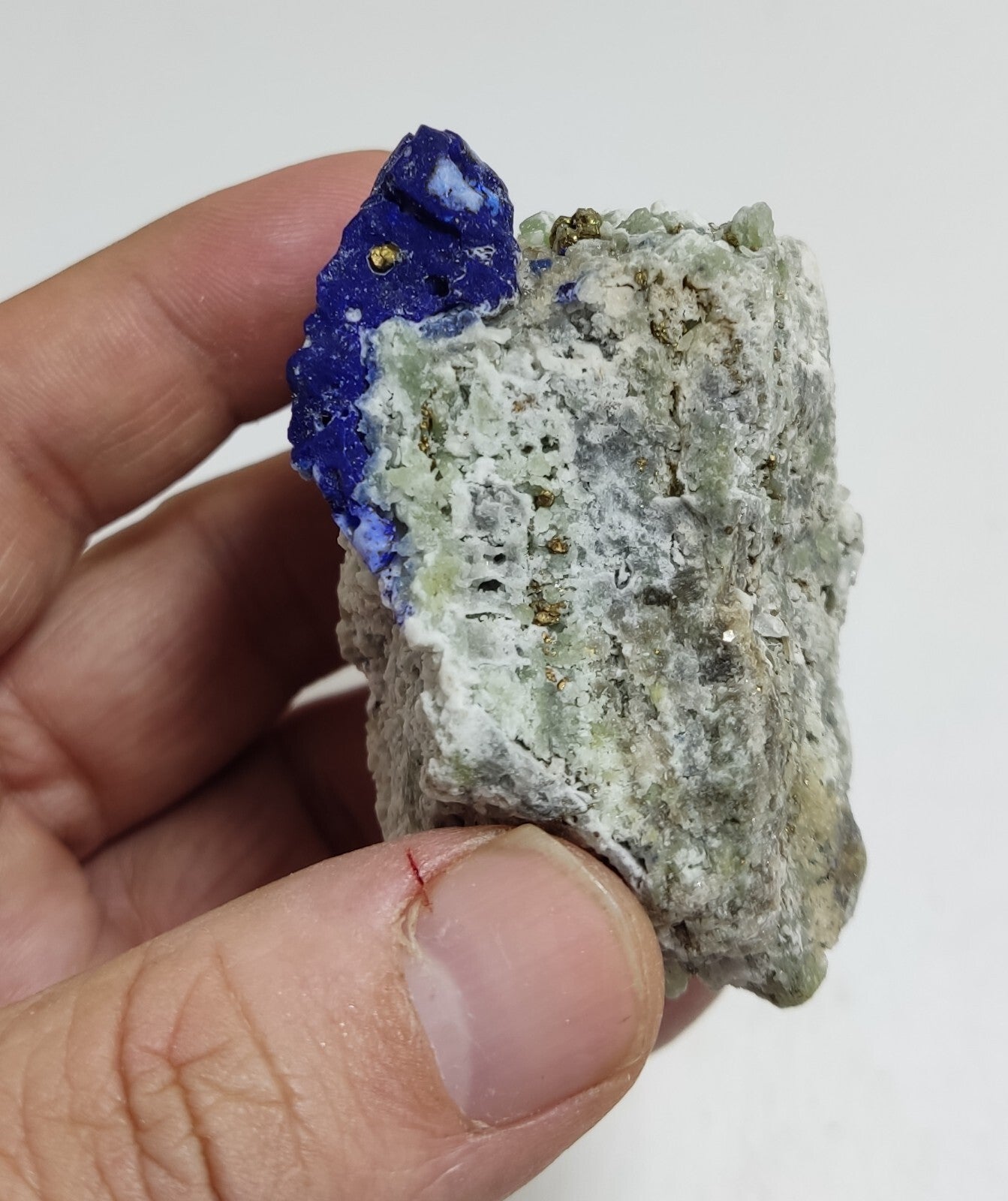 An Aesthetic specimen of fluorescent Lazurite with pyrite 181 grams