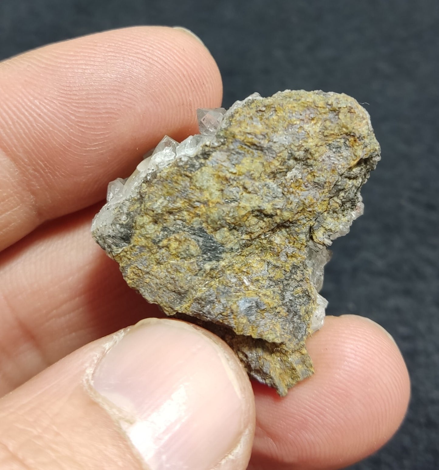 An Aesthetic quartz/calcite crystal specimen with petroleum inclusions 15 grams