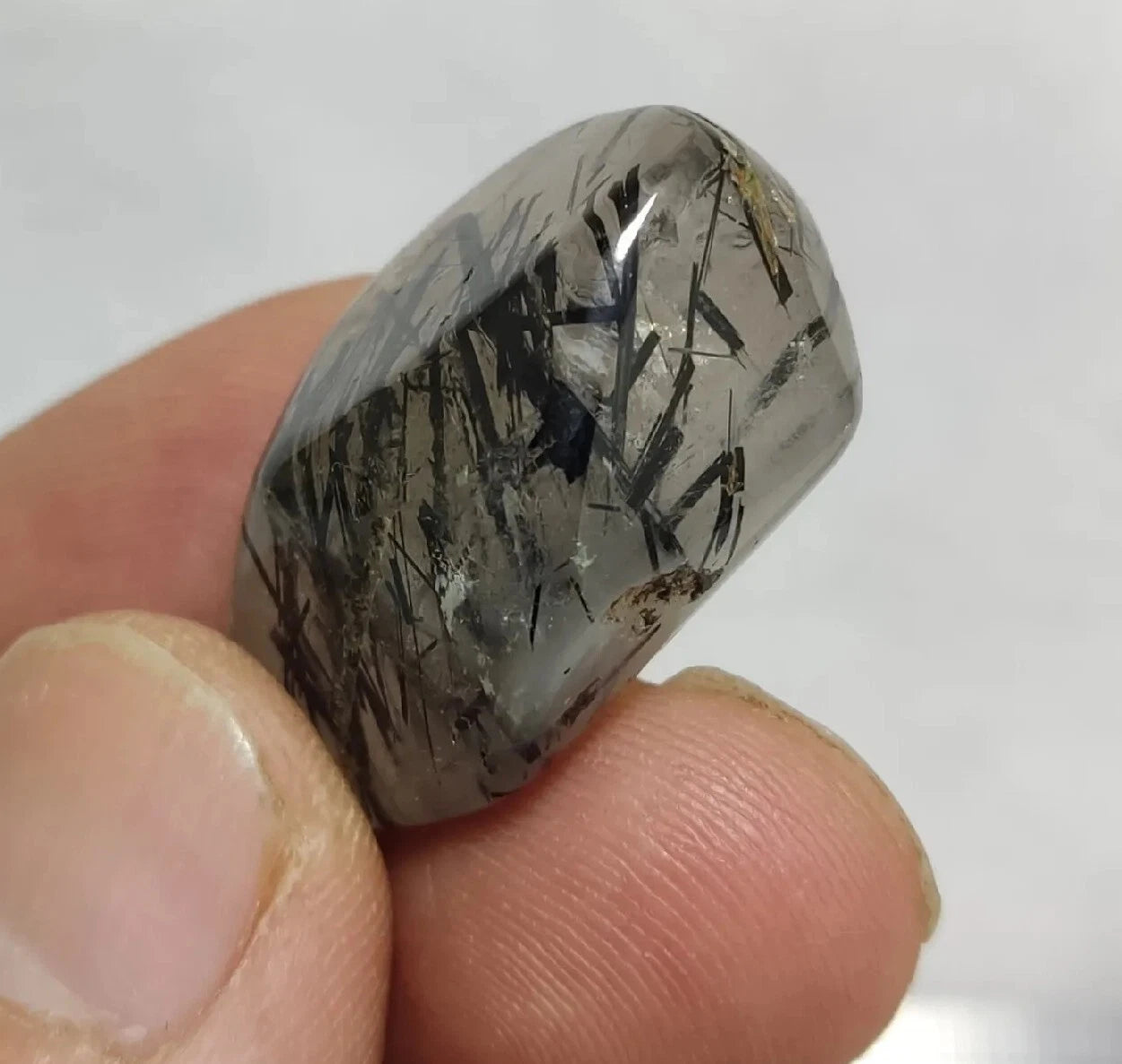 Rutiles/aegirine/ Unconfirmed quartz polished tumble 75 carats