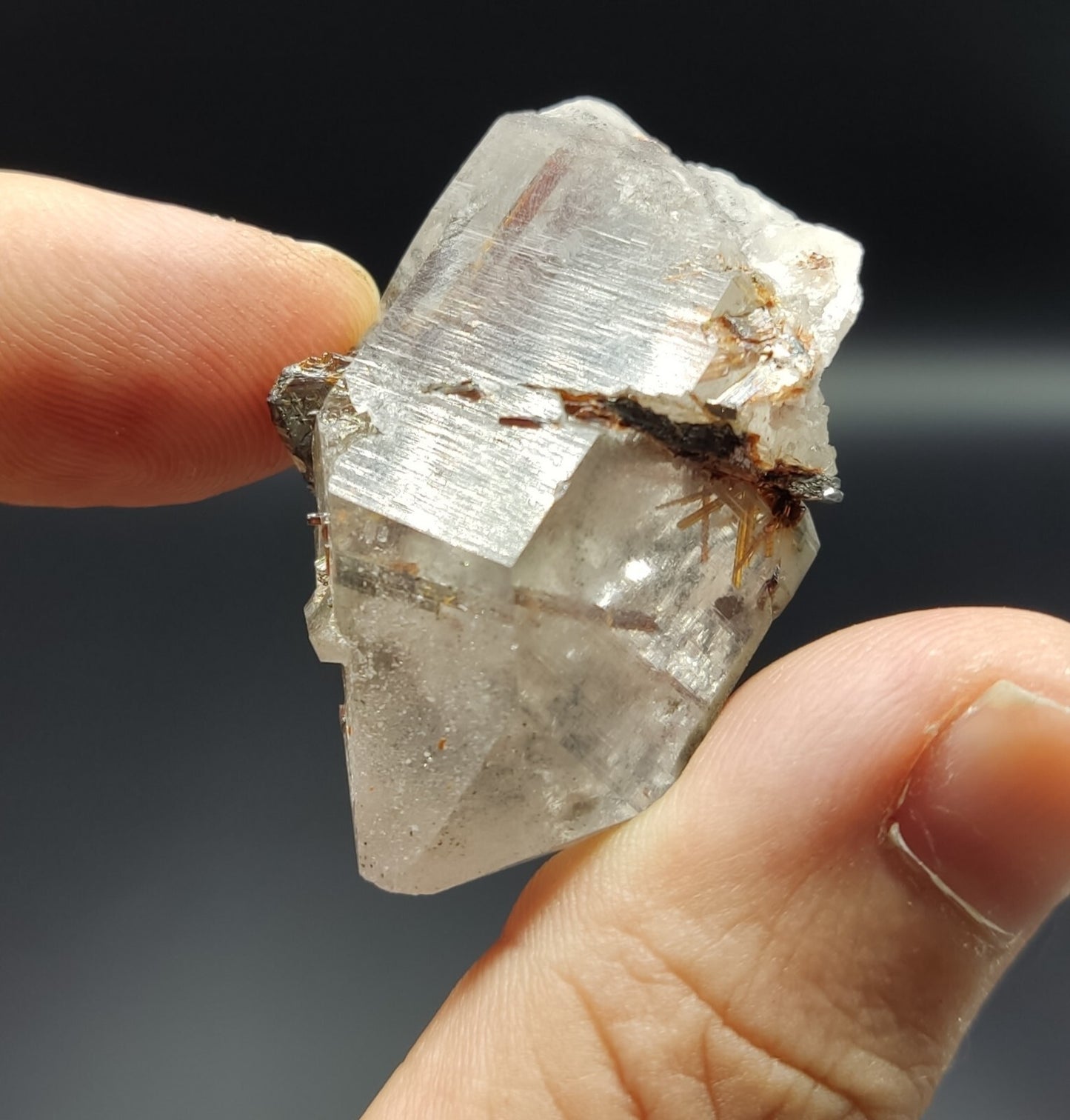 An aesthetic specimen of quartz with hematite and rutile inclusions 28 grams