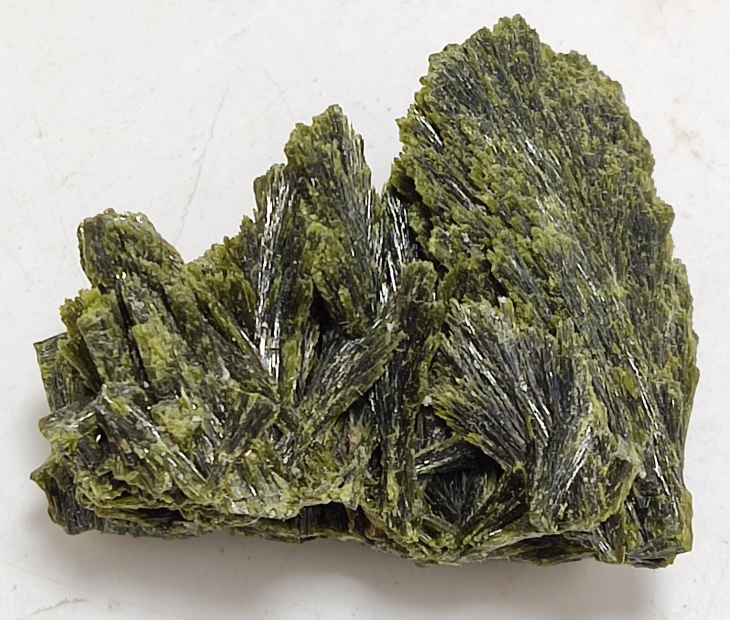 An aesthetic specimen of epidote crystal spray type 24 grams