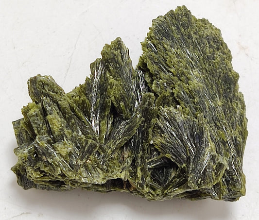 An aesthetic specimen of epidote crystal spray type 24 grams