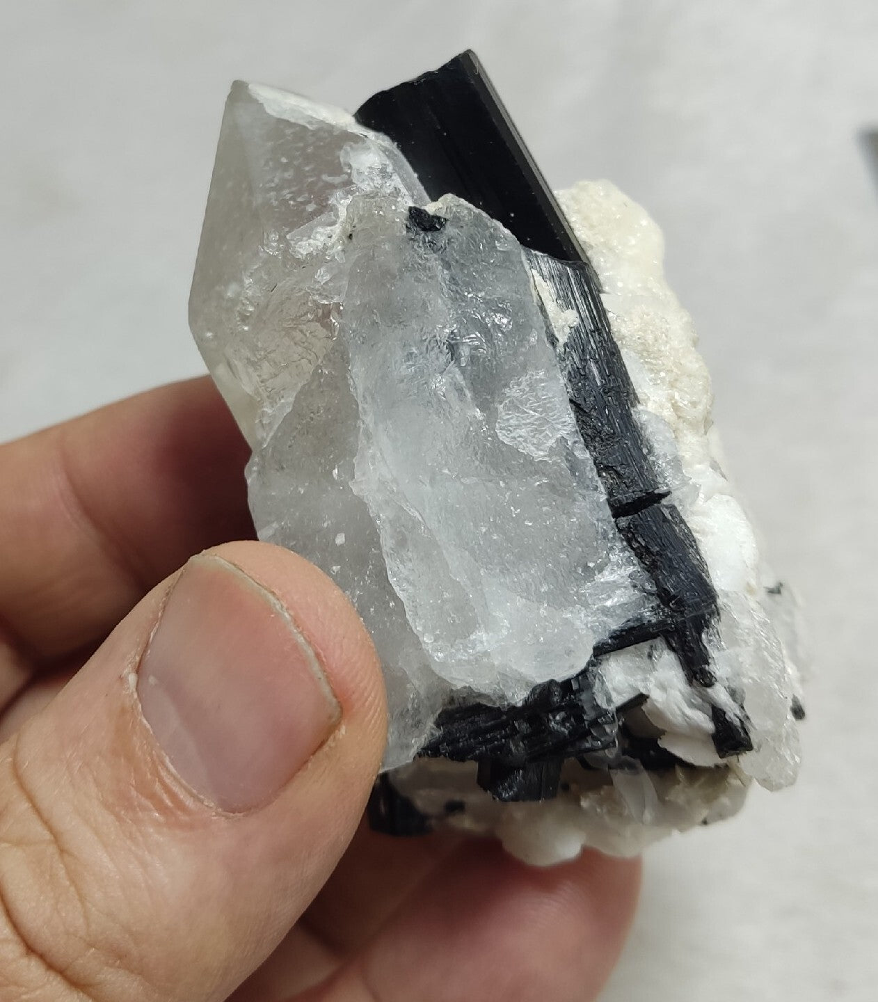Natural quartz crystal with black tourmaline 145 grams
