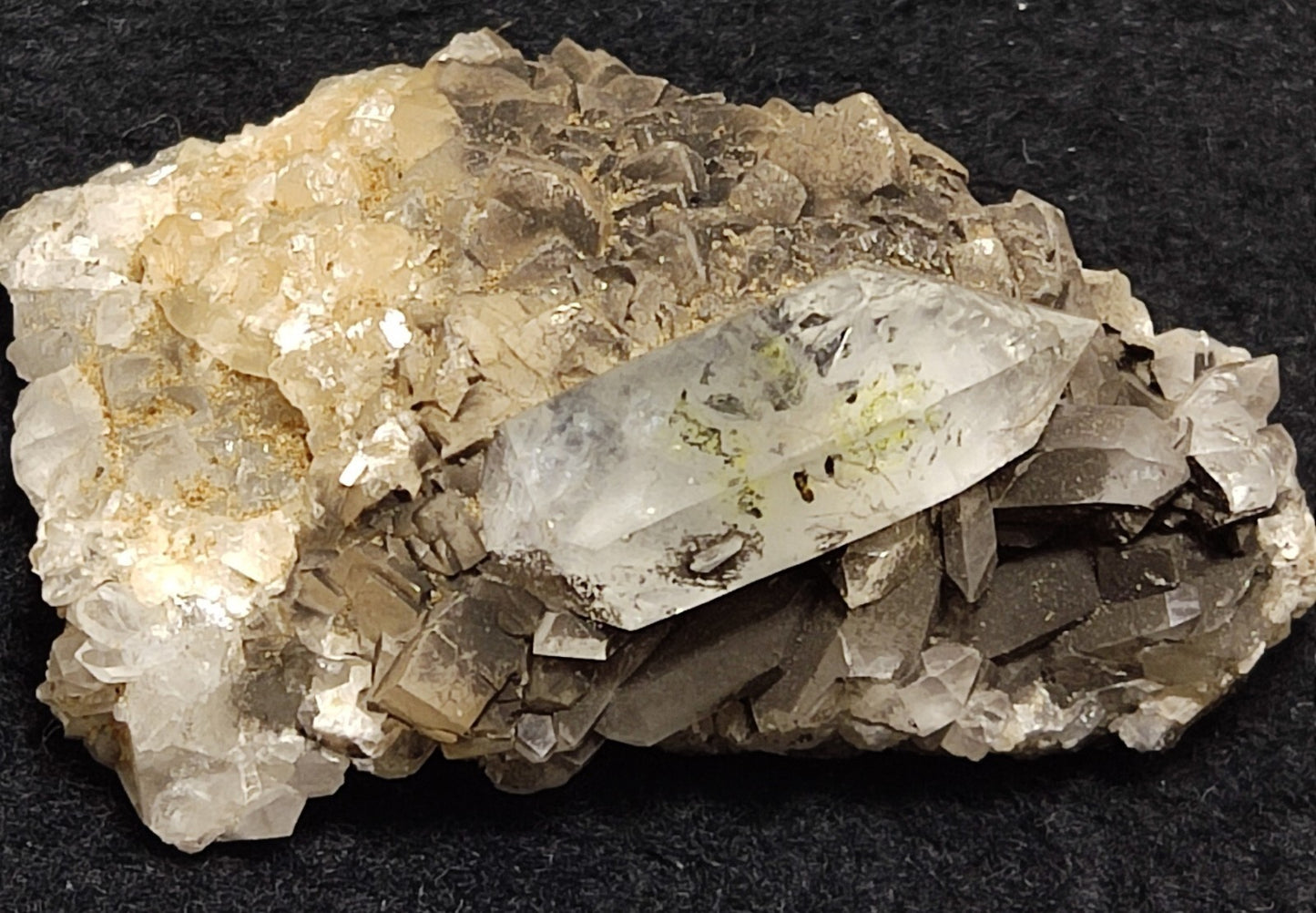 An Aesthetic quartz/calcite crystal specimen with petroleum inclusions 23 grams