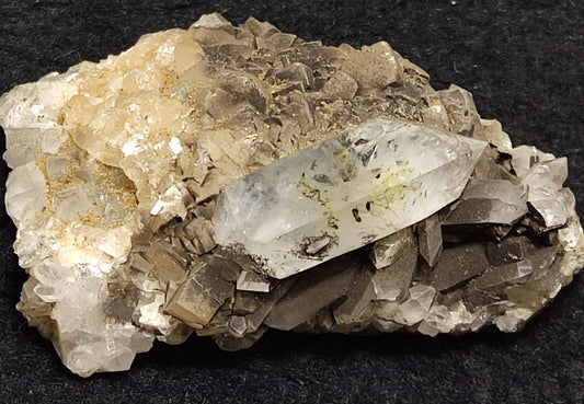 An Aesthetic quartz/calcite crystal specimen with petroleum inclusions 23 grams