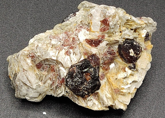 An aesthetic specimen of spessartine garnets on muscovite 36 grams