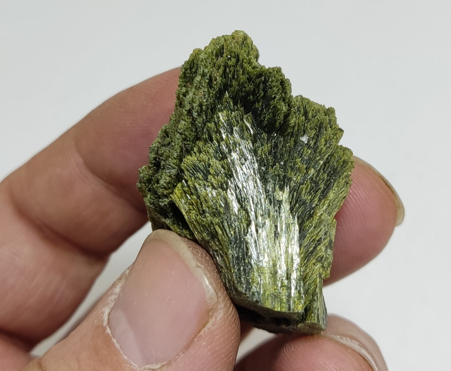 An aesthetic specimen of epidote crystal spray type 35 grams