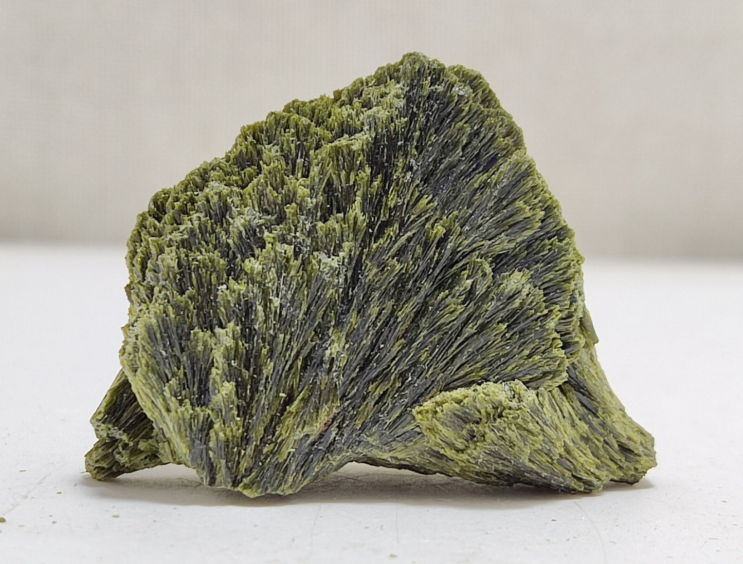 An aesthetic specimen of epidote crystal spray type 22 grams