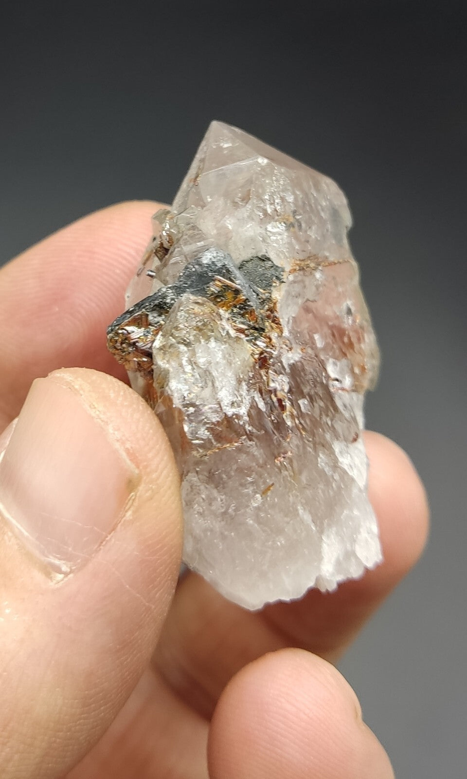An aesthetic specimen of quartz with hematite and rutile inclusions 28 grams
