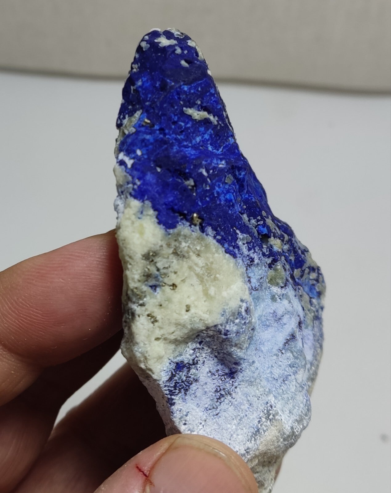 An Aesthetic specimen of fluorescent Lazurite with Pyrite 128 grams